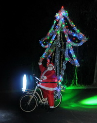 Santa with Xmas tree and World's brightest bike lights
